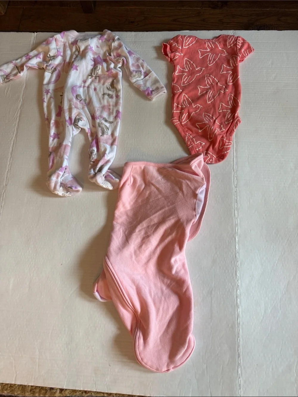 Aden & Anais Sleep sack, Burt’s Bees Footed sleeper, Carter’s onesie